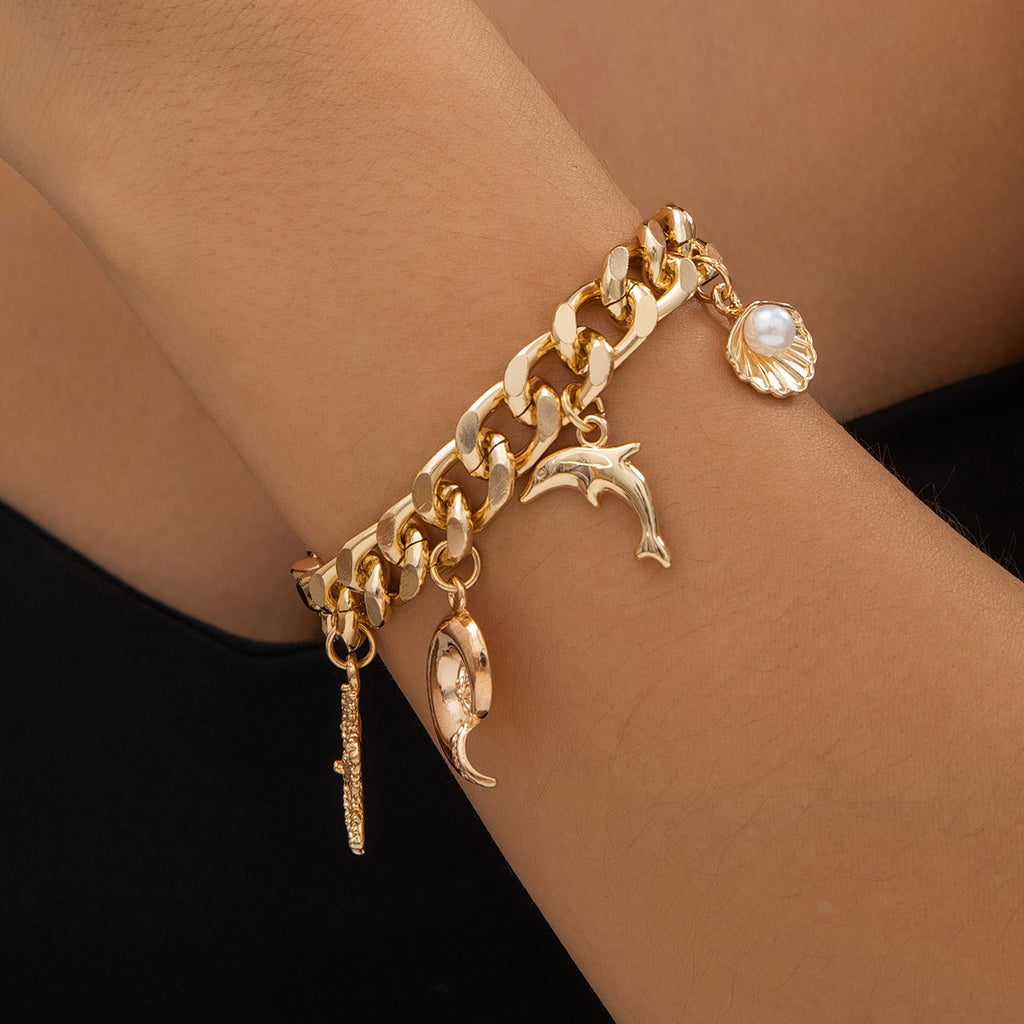 Colier et bracelet doré de symbol plage