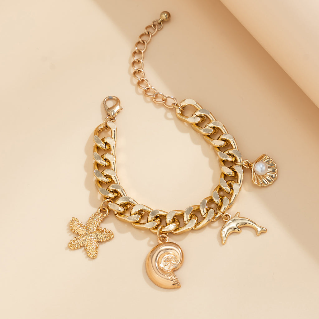 Colier et bracelet doré de symbol plage